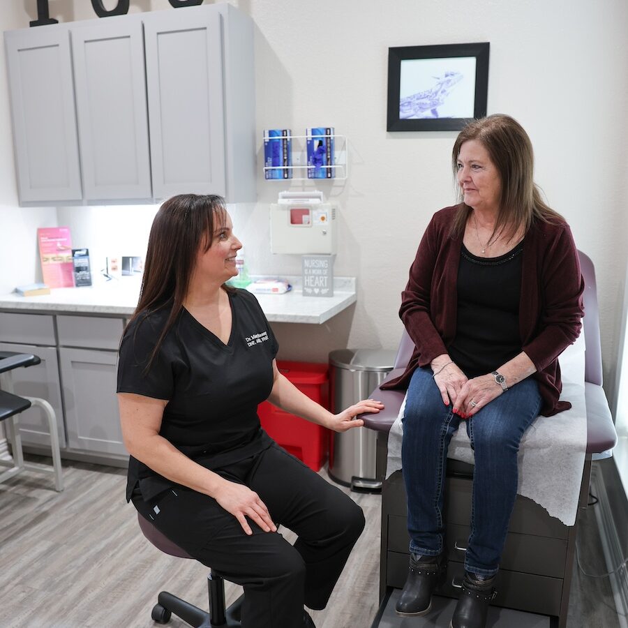JM provider speaking with a patient in a consultation room
